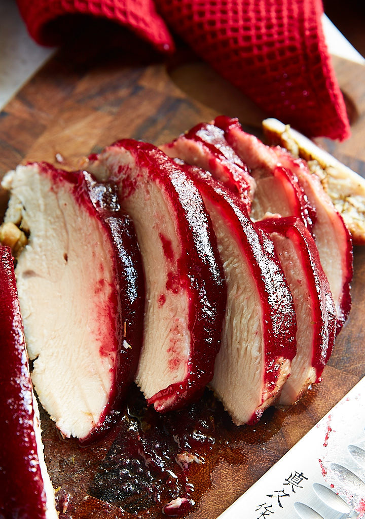 Close up of cranberry glazed turkey breast slices.