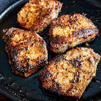 Delicious, tender and juicy pan-fried boneless pork chops made in under 10 minutes. A perfect recipe for a busy workday dinner. | ifoodblogger.com