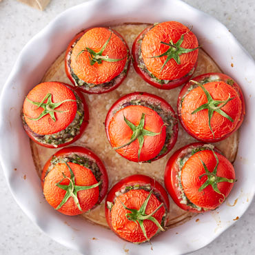 Ridiculously flavorful and delicious stuffed tomatoes with beef and rice, called tomato dolmas. Served with hot tomato sauce that is out-of-this-world good.
