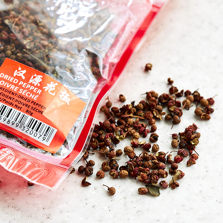 Szechuan peppercorns on a table.