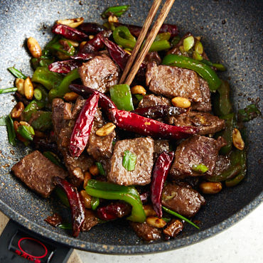 Kung Pao Beef is a Chinese dish that combines sliced steak, a sauce, vegetables and peanuts. Spiced with traditional Szechuan peppers and red chiles, this dish will make you forget about take out for good.