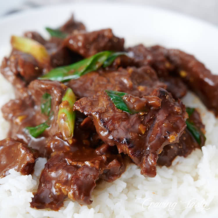 A bowl of Mongolian beef over white rice.