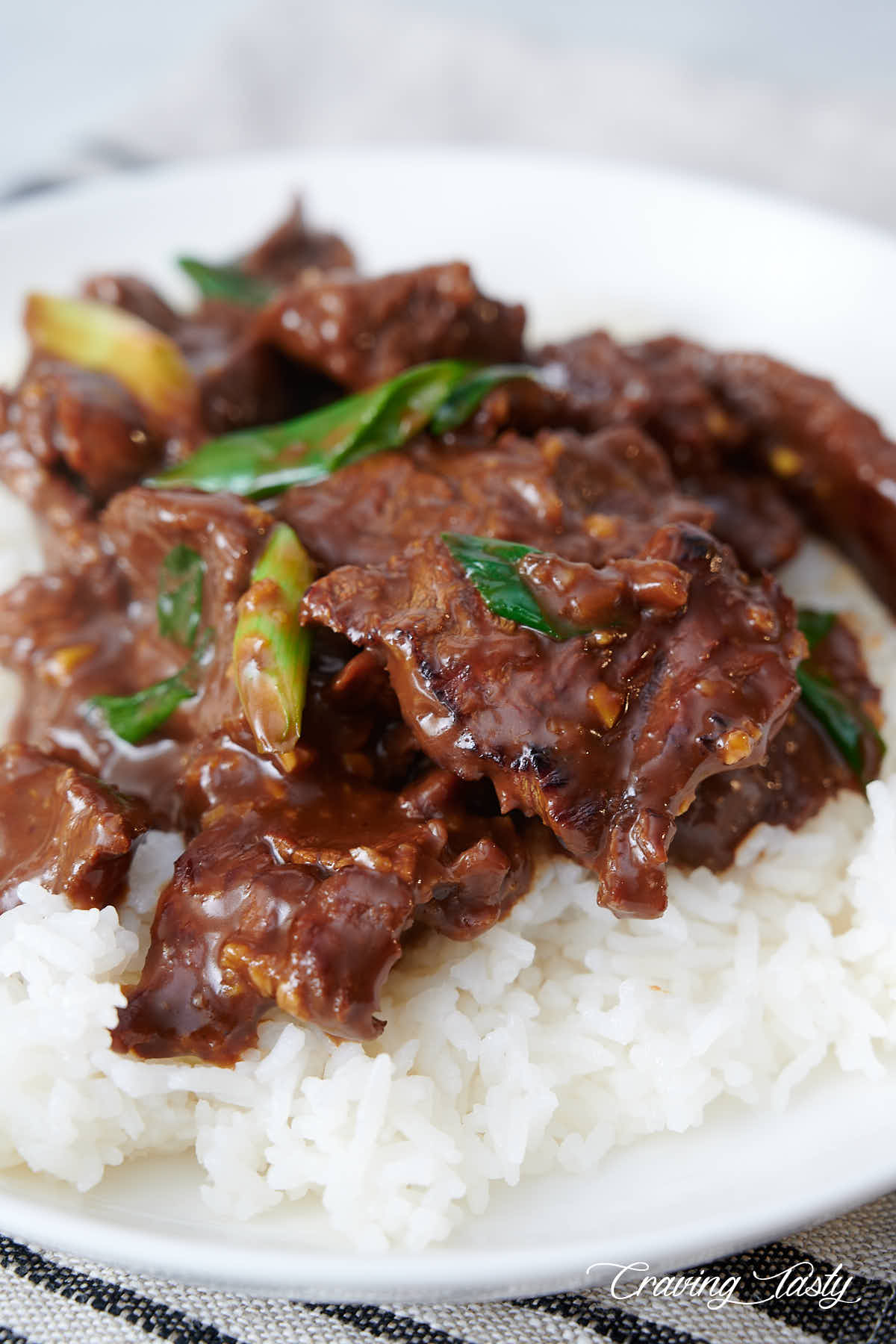 A bowl of Mongolian beef over white rice.