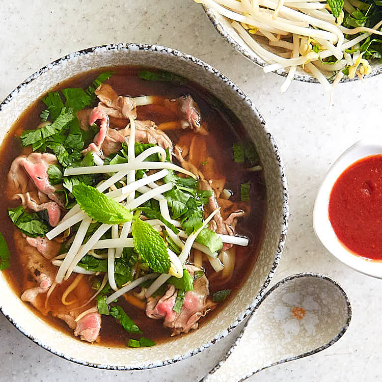 Authentic beef pho (pho bo) that will captivate you with its aroma and the taste that seamlessly combines salty, sweet, and umami all in one. The beef pho recipe comes from a restaurant that is famious for its pho bo. A must try. | ifoodblogger.com