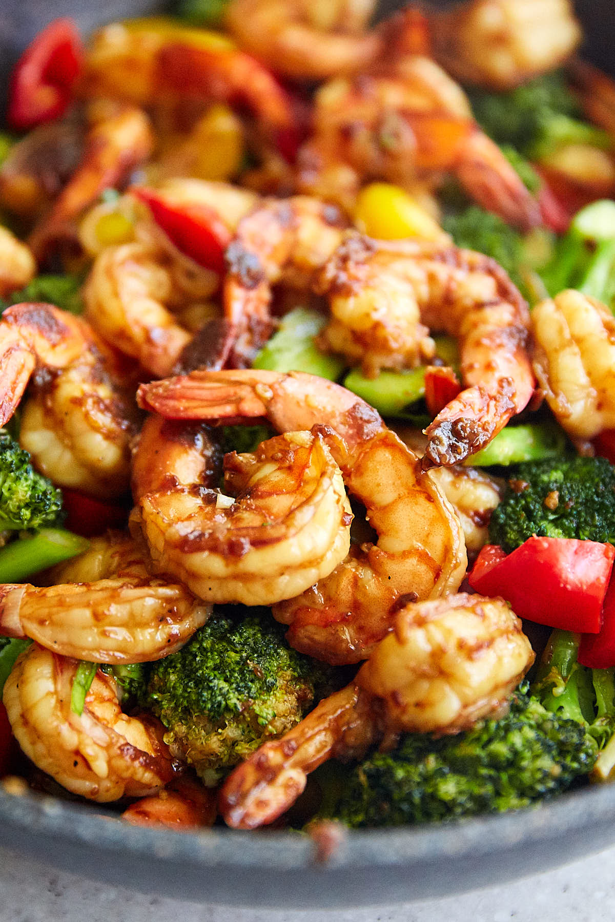 Szechuan shrimp with vegetables in a wok.