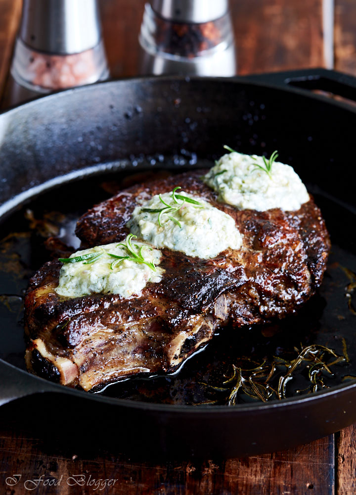 Pan-seared ribeye steak in a cast iron pan.