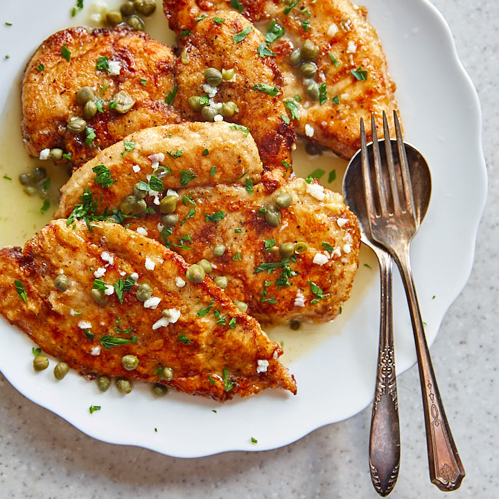 Crispy chicken francese on a white serving platter.