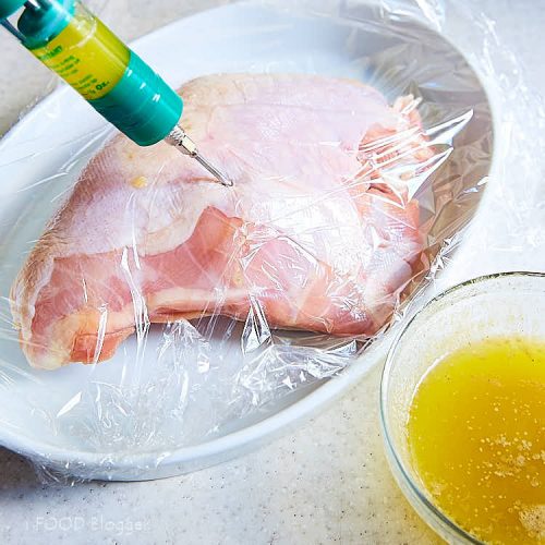 Roasted turkey breast - injecting infused butter into turkey breast. | ifoodblogger.com