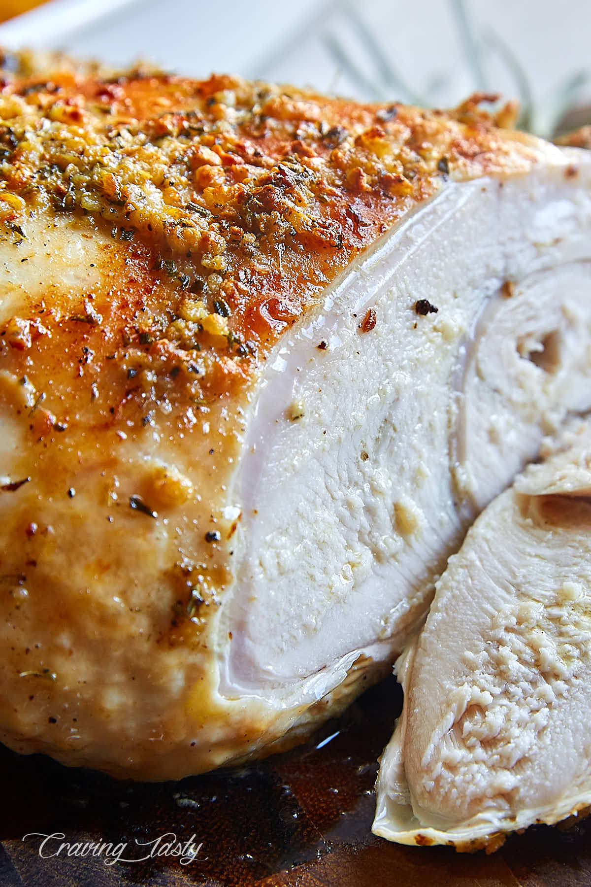 Roast turkey breast sliced, very juicy meat showing.