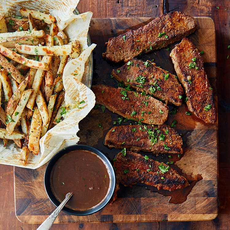 Tri-Tip Steak served with truffle fries and red wine sauce.