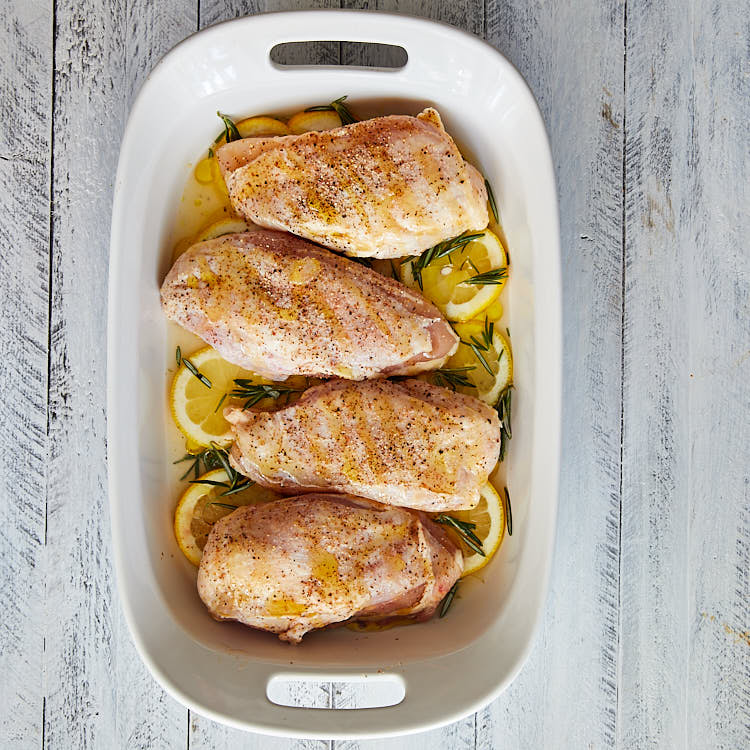 Baked Bone-In Lemon Chicken Breast- add chicken and drizzle with olive oil