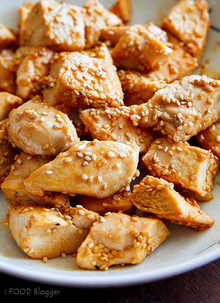 A close up of hibachi style cooked chicken pieces on a plate.