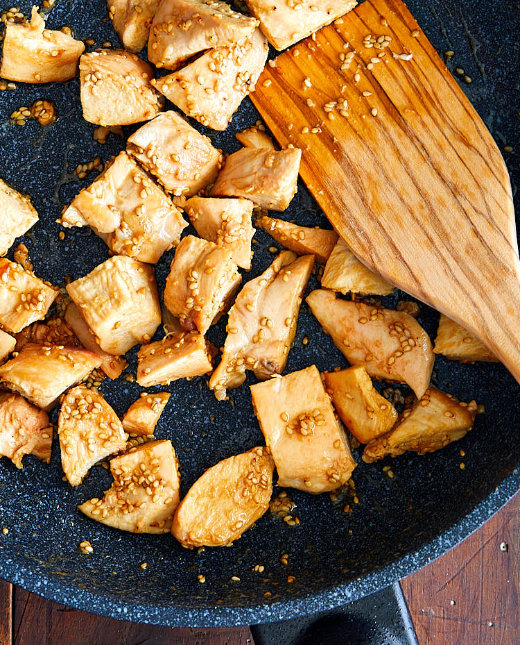 Hibachi chicken on a skillet with a spatula.