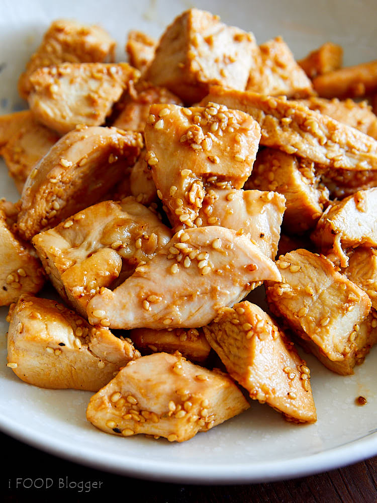 A pile of hibachi chicken pieces on a white plate.