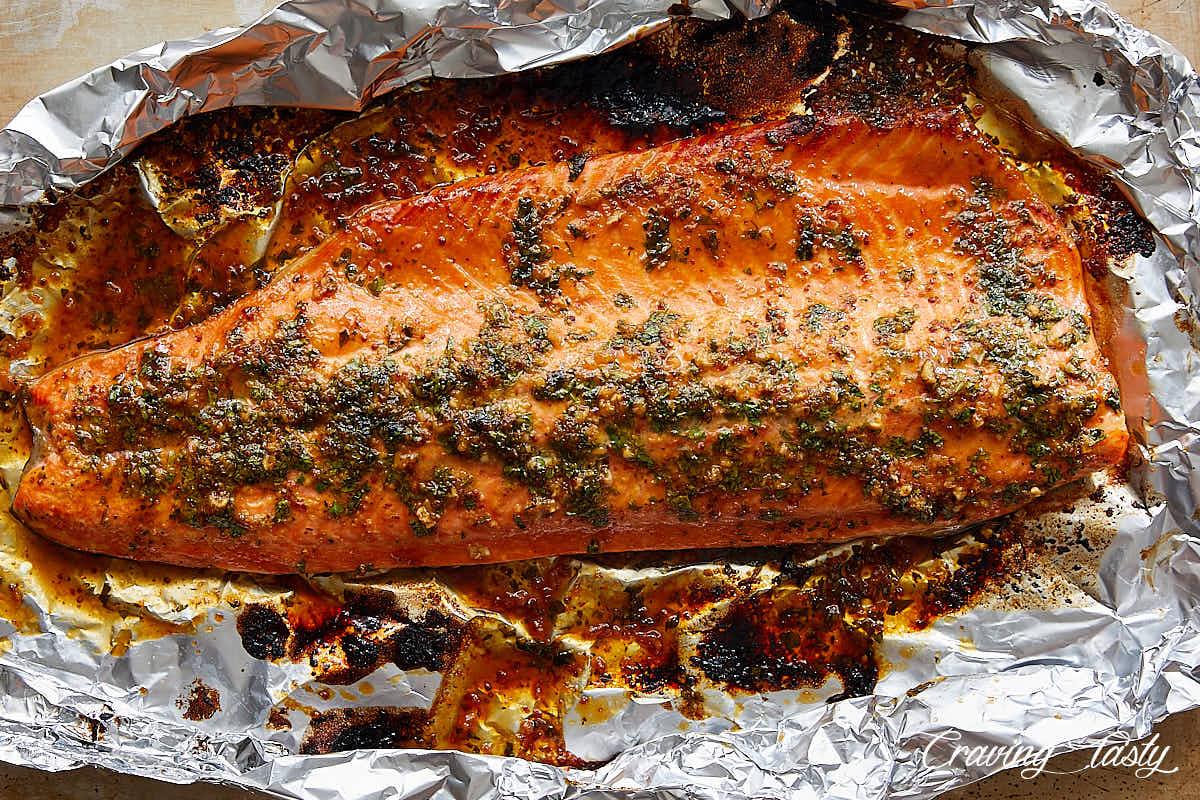 Baked steelhead trout on foil.