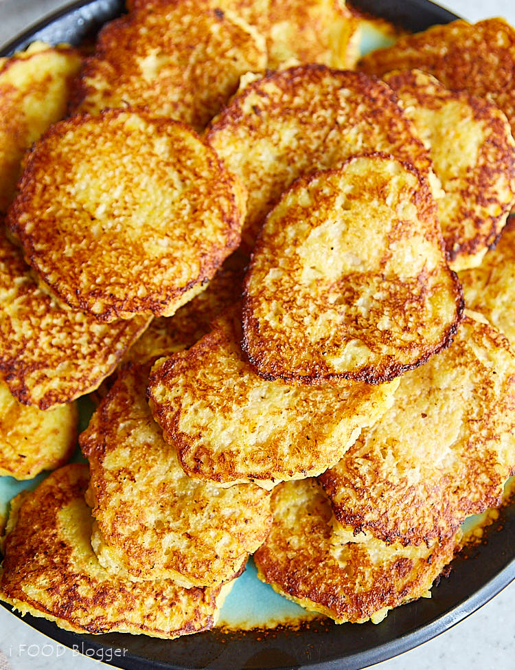 A big platter with golden brown potato pancakes.