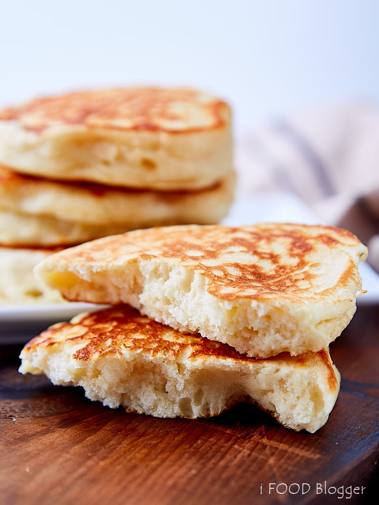 A pancake split in half, showing fluffy crumb.