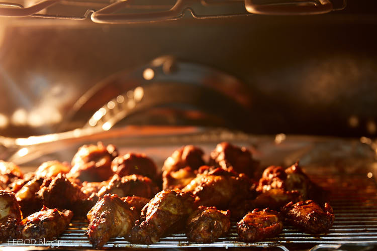 Chicken Wings Reheating Under Broiler.