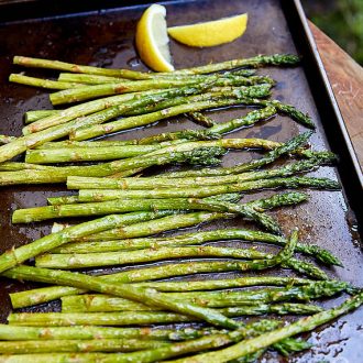 Boiled asparagus, tenderized with a quick parboil, seasoned with lemon juice, salt and pepper, and garnished with Parmigiano Reggiano cheese. | ifoodblogger.com