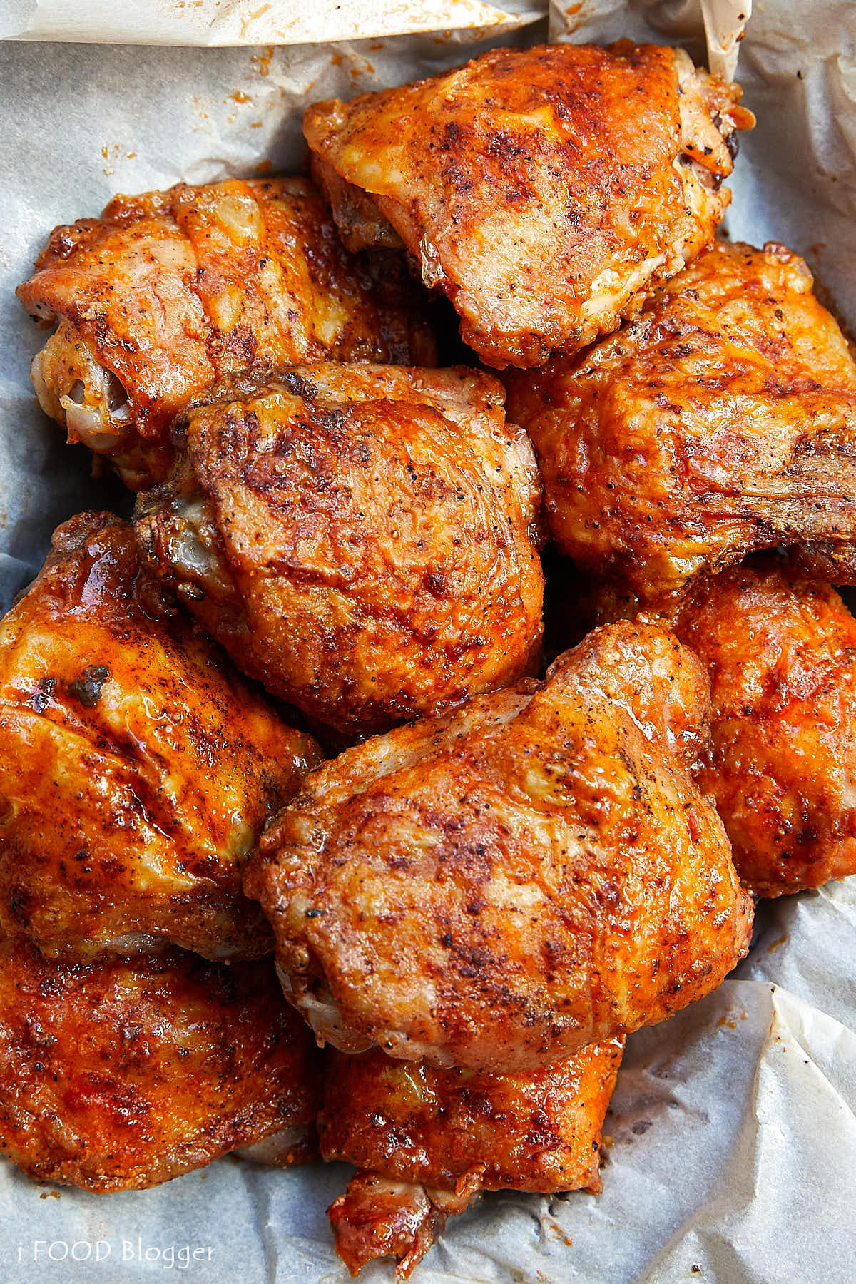 These oven-fried chicken thighs are extra crispy on the outside and very tender and juicy on the inside. There isn't a more succulent baked chicken thigh than this. They are like deep-fried chicken thighs, only without a mess and all the added calories. Oh, and they only take about 30 minutes to bake. | ifoodblogger.com