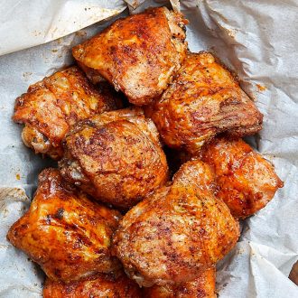 These baked chicken thighs are extra crispy on the outside and very tender and juicy on the inside. There isn't a more succulent baked chicken thigh than this. They are like deep-fried chicken thighs, only without a mess and all the added calories. Oh, and they only take about 30 minutes to bake. | ifoodblogger.com