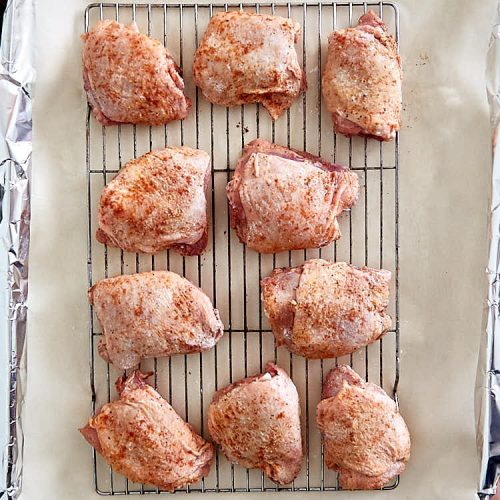Oven-fried chicken thighs, seasoned with salt, pepper and paprika.