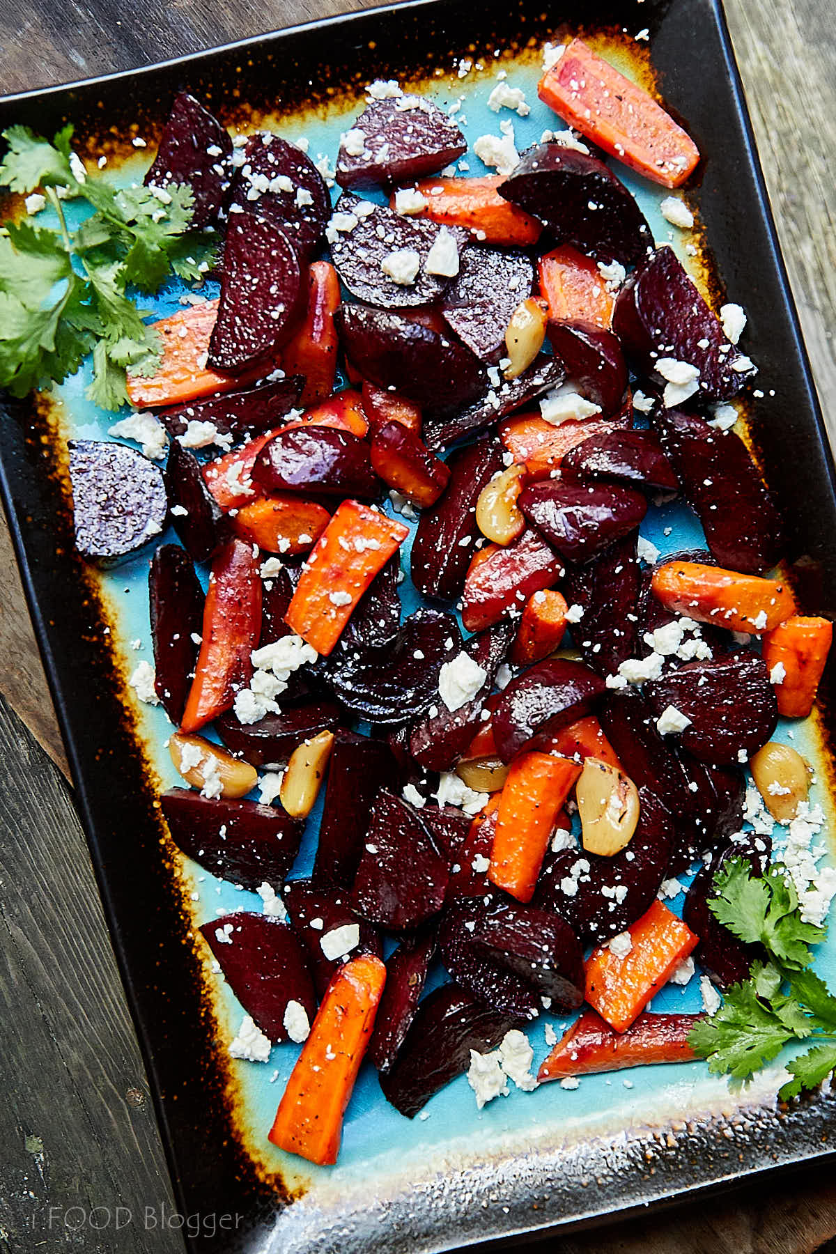 Roasted Beets and Carrots with Feta on a platter.