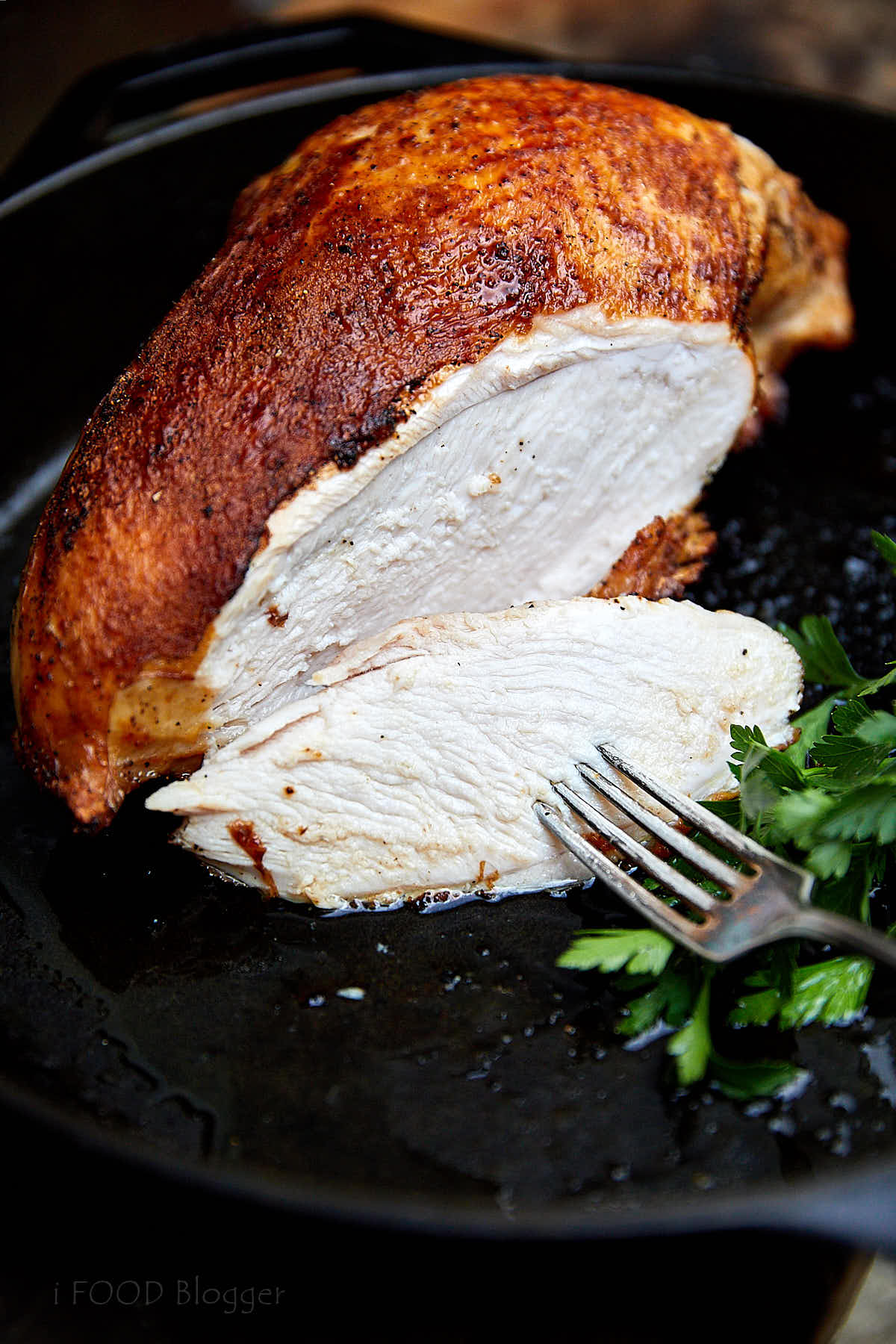 Turkey bread sliced, showing juicy meat.