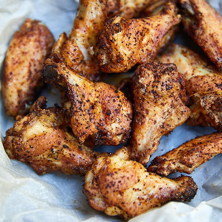 These air fryer chicken wings are extra crispy on the outside and super juicy inside. They are like deep-fried wings, only without a mess and added calories. They taste amazingly good! I guarantee you, these are some of the best chicken wings you can make. These chicken wings are a must try! Oh, and they only take 20 minutes to fry. Great for keto, paleo and low carb diets.| ifoodblogger.com
