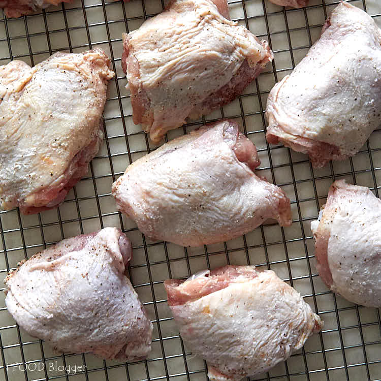 Baked BBQ Chicken Wings - Step 2 - rubs seasonings for even coverage.