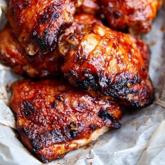 These are absolutely the best Baked BBQ Chicken Thighs. They are first oven fried on convection to get an extra crispy skin, then brushed with a special BBQ sauce and baked for a little longer on convection. This gives these BBQ chicken thighs an amazing flavor that is comparable to grilling. Once you try these chicken thighs you will be hooked for good. | ifoodblogger.com