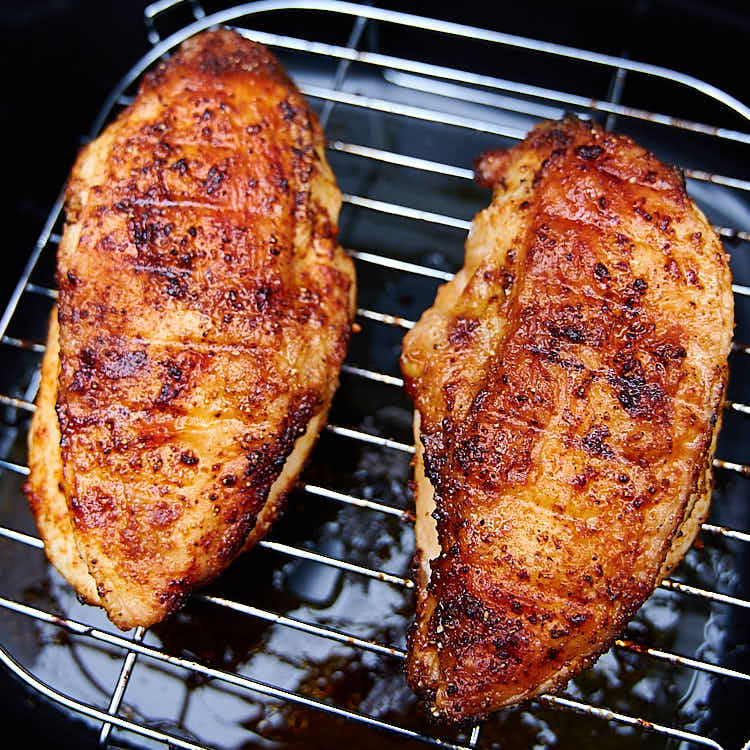 This air fryer chicken breast is crispy on the outside and very juicy inside. It's ridiculously delicious! This chicken breast tastes just like fried, only without an oily mess and added calories. I guarantee you, this is one of the best chicken breasts you can make. They are a must try! Oh, and they only take 30 minutes to cook. A great chicken breast recipe for keto, paleo, weight watchers and low carb diets.| ifoodblogger.com