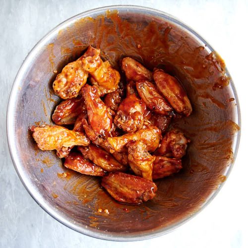 Best Baked BBQ Chicken Wings, period. First, the wings are baked on convection until super crispy, then coated in BBQ sauce and baked some more. The end result is sticky and addictive baked chicken wings that you can't have enough of. | ifoodblogger.com