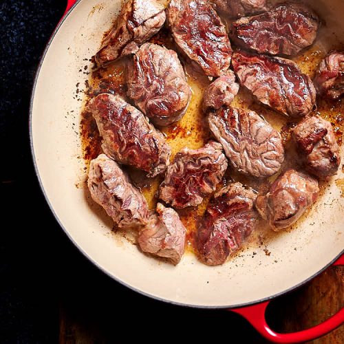 Braised Beef - searing beef in a braising pan.