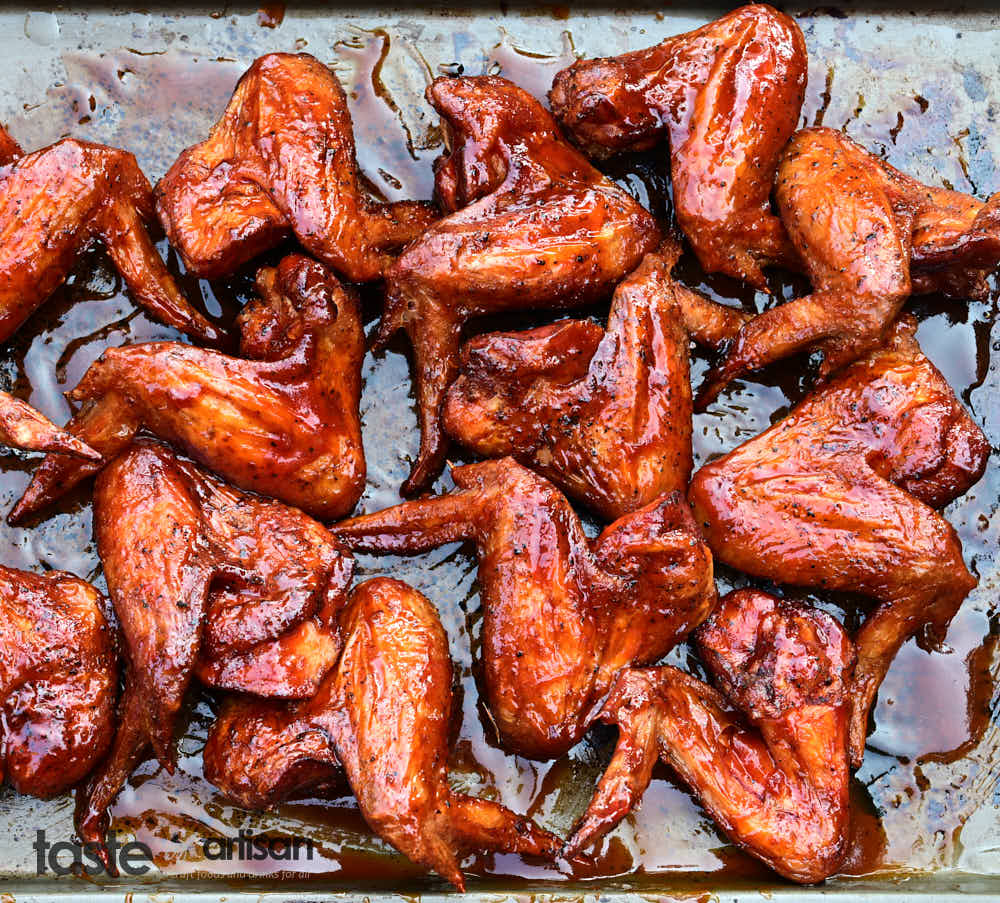 Extra-crispy smoked chicken wings with BBQ sauce.