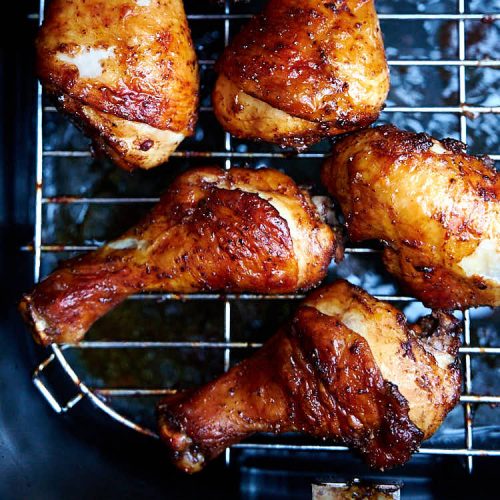 Air fryer chicken legs that are tender and juicy on the inside and crispy and caramelized on the outside. They are like grilled, only quicker and without a fuss. The best air fried chicken legs, period. Perfect for parties and game days as take less than 30 minutes to make. | ifoodblogger.com