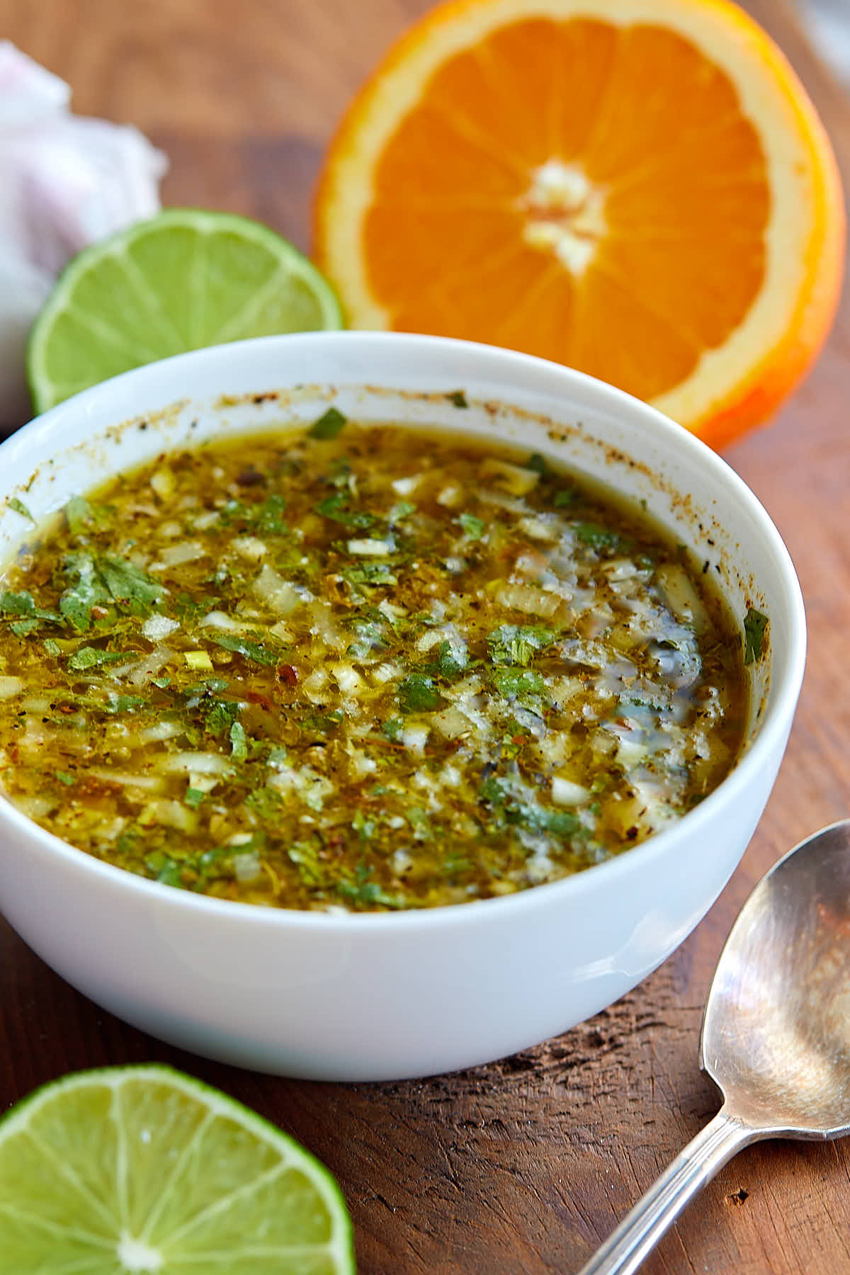 A close up of a white bowl with mojo sauce in it.