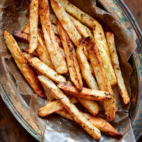 These air fryer French fries are extra crispy and crunchy on the outside and creamy on the inside. They are like deep-fried fries, only without a mess and added calories. They taste amazingly good! I guarantee you, these are some of the best French fries you can make at home. These French fries are a must try! | ifoodblogger.com