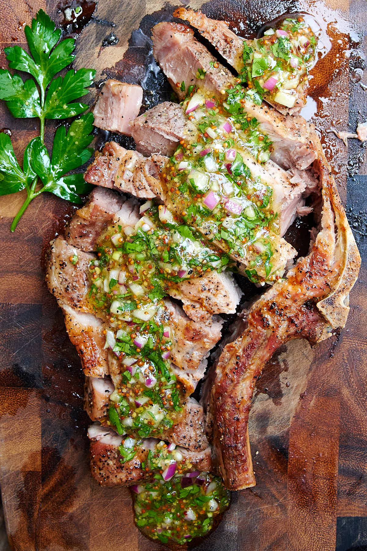 Sliced air fryer steak on a cutting board.