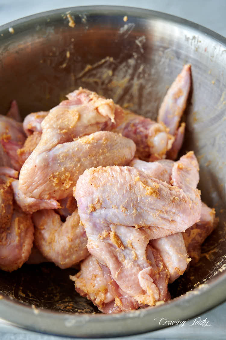 Chicken wings tossed in melted butter and seasonings.