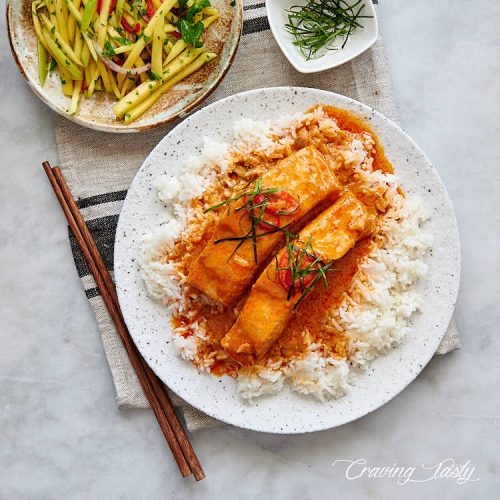 Salmon pan-seared in delicious Thai red curry sauce.