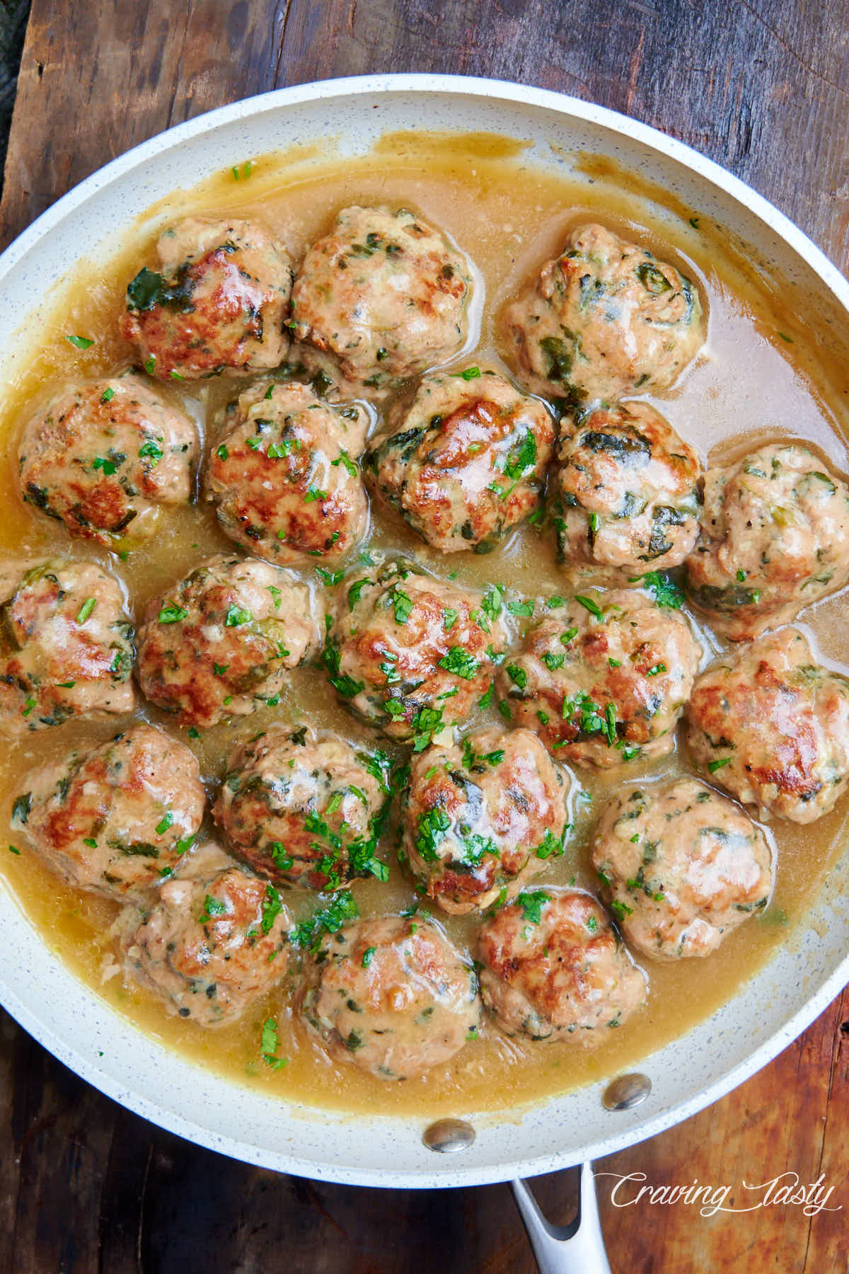 Turkey meatballs in a white pan.