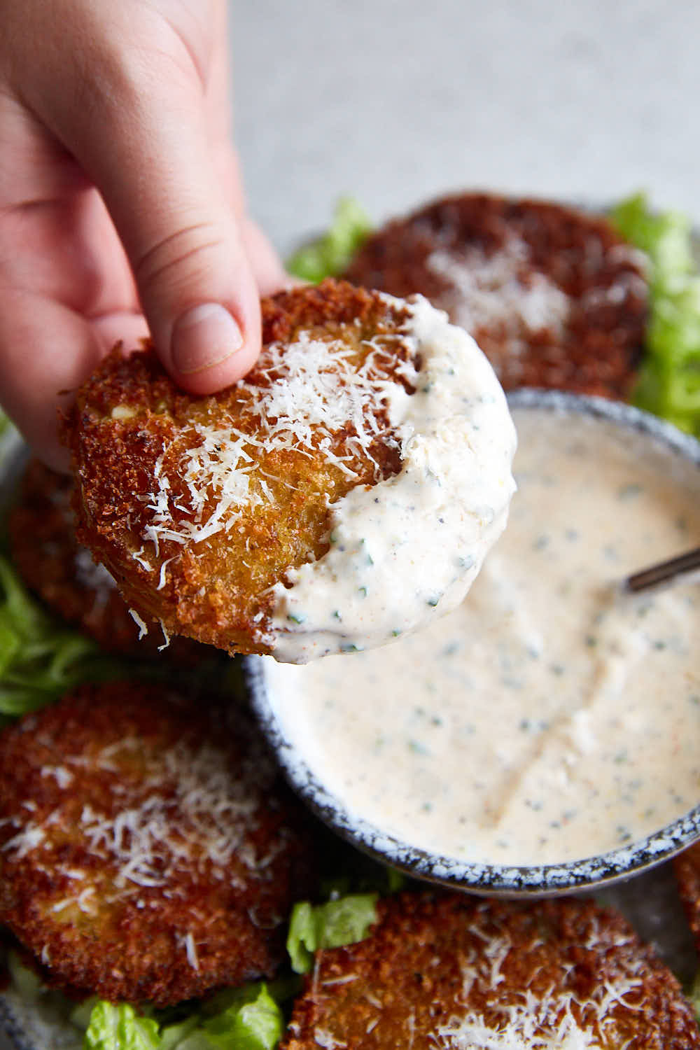 Fried Green Tomatoes dipped in white dipping sauce