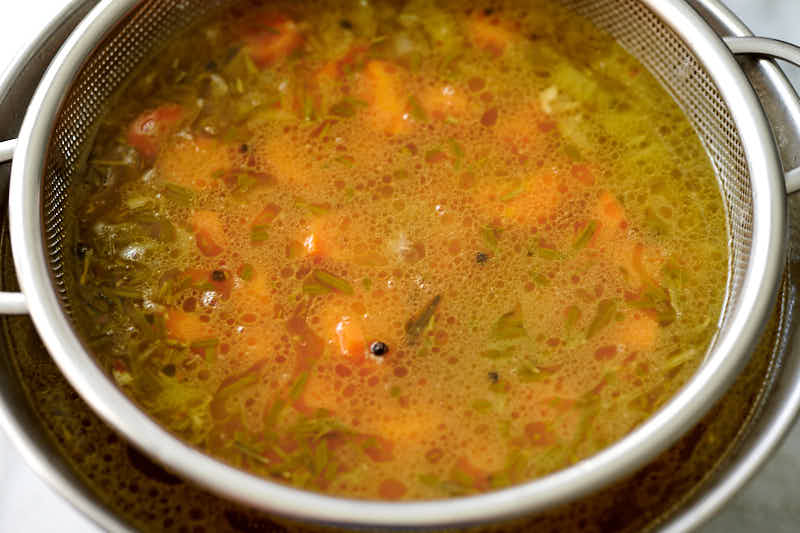 Straining chicken broth