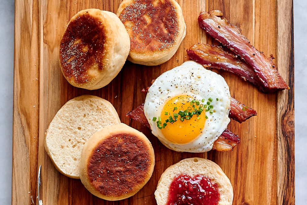 Oven-baked bacon with homemade English muffins.