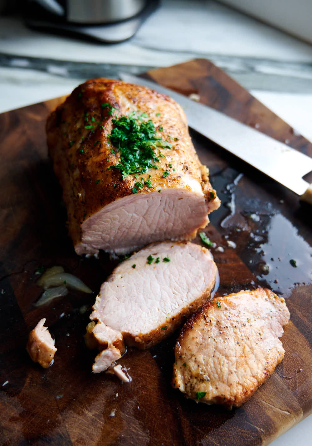 Juicy, tender pork loin roast, braised low and slow in the oven.