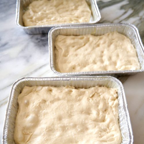 Focaccia dough in pans