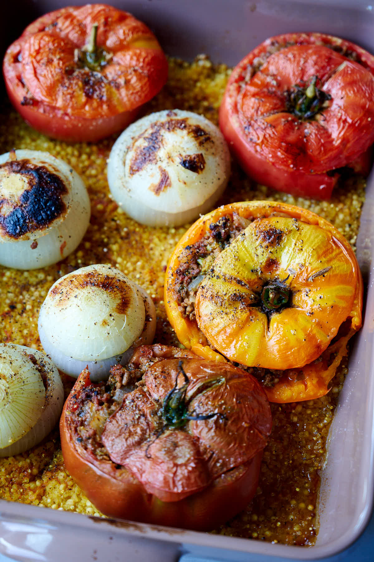 Tomatoes and onions, stuffed with beef and vegetables, and baked in one pan with ancient grains such as quinoa and bulgur, and seasoned with aromatic spices to give you a flavor explosion in your mouth.